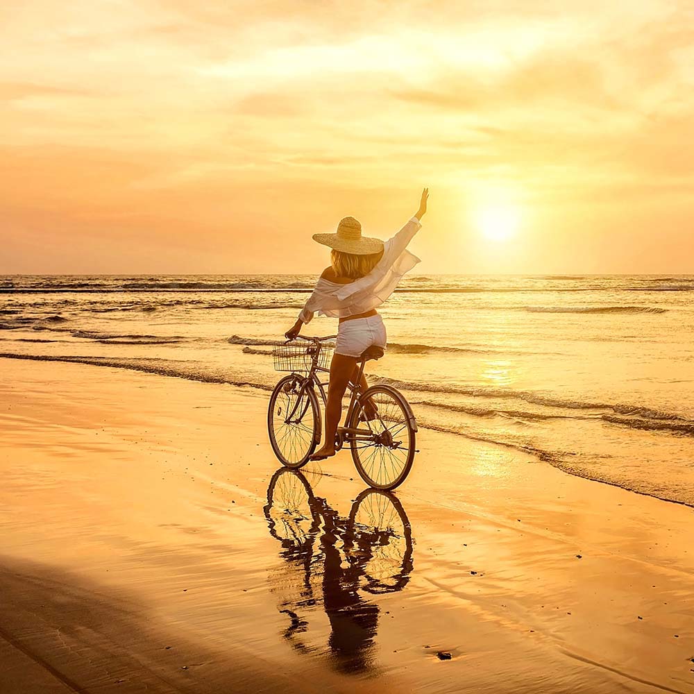 Woman on bike near Portside Ventura Harbor in Ventura, California